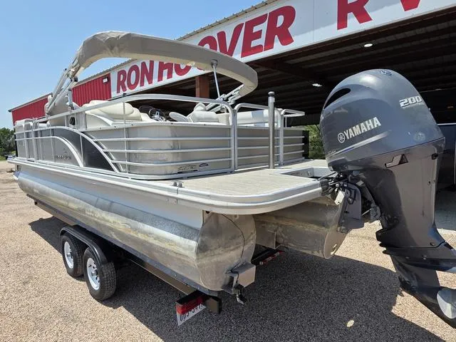 Slide: The Image of 2013 Bennington 2275GLW pontoon boat with Yamaha 200 engine on trailer. - 2