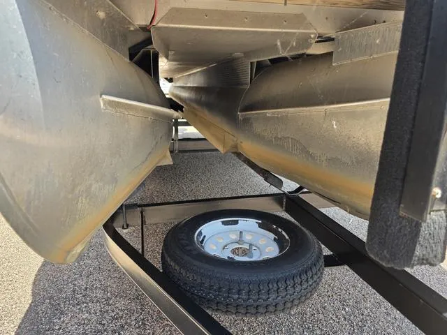 Slide: The Image of 2013 Bennington 2275GLW pontoon boat interior with spacious seating and storage compartment. - 20