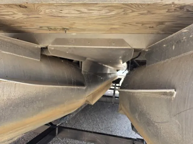 Slide: The Image of Underneath view of a 2013 Bennington 2275GLW pontoon boat with spare tire on trailer. - 21