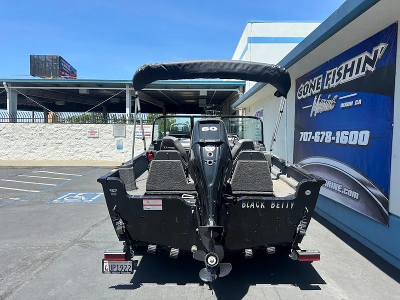Slide: The Image of 2022 Lund 1650 Rebel XL Sport boat, black, parked outside Gone Fishin' Marine dealership. - 10