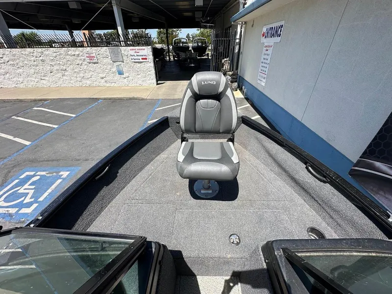 Slide: The Image of 2022 Lund 1650 Rebel XL Sport boat with a single seat on deck. - 20