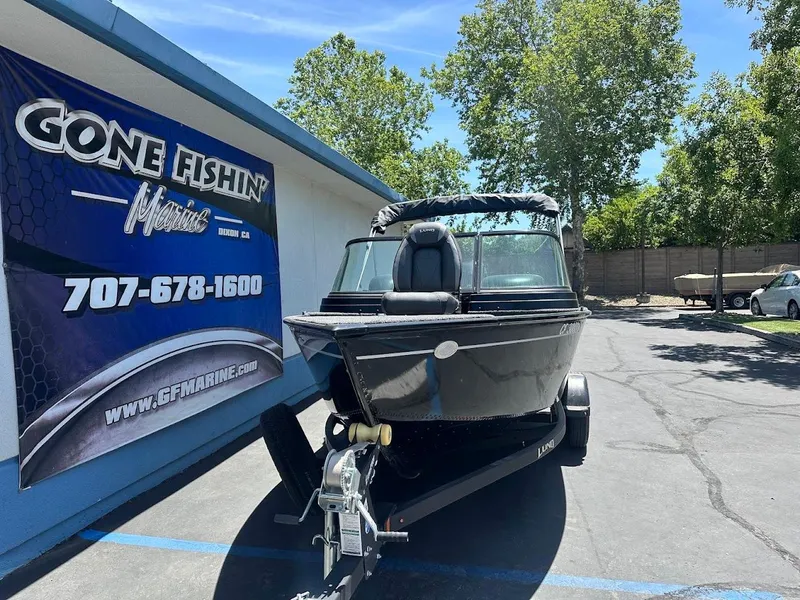 Slide: The Image of 2022 Lund 1650 Rebel XL Sport boat on trailer at dealership. - 3