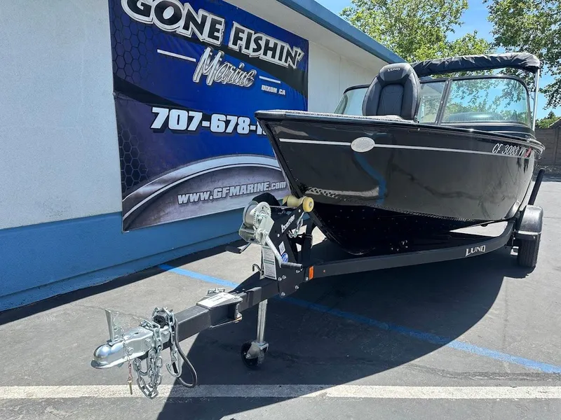 Slide: The Image of 2022 Lund 1650 Rebel XL Sport boat on trailer at dealership. - 4