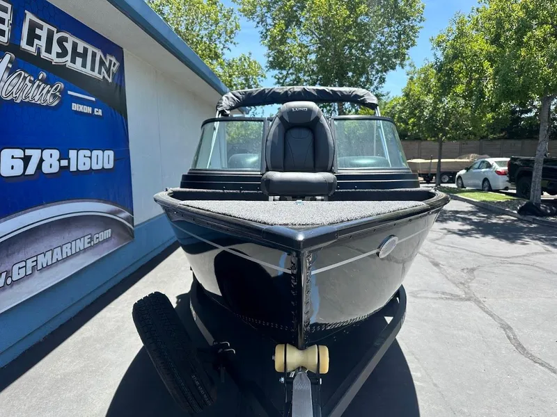 Slide: The Image of 2022 Lund 1650 Rebel XL Sport boat parked outdoors, front view. - 5