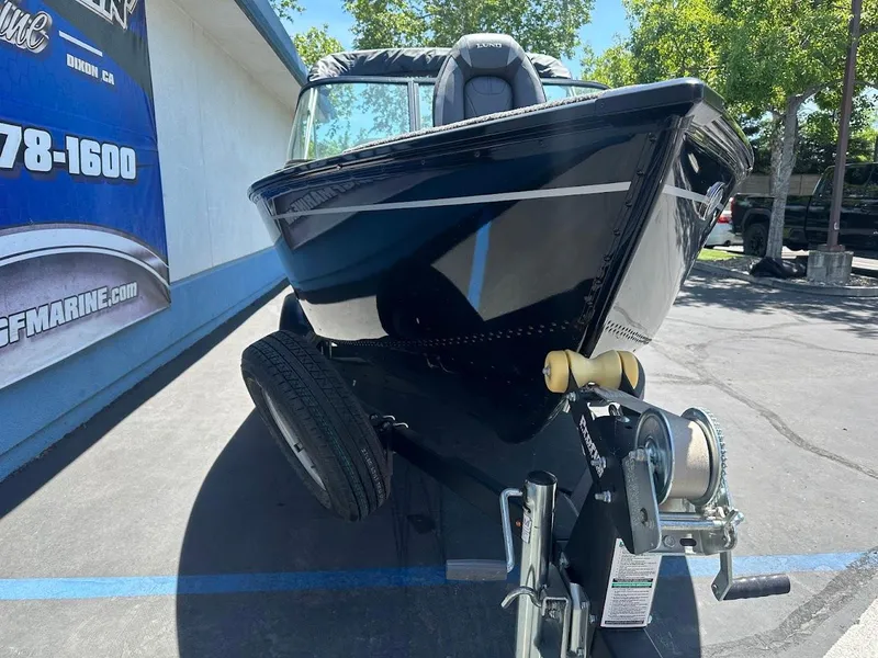 Slide: The Image of 2022 Lund 1650 Rebel XL Sport boat on trailer, parked outdoors. - 6