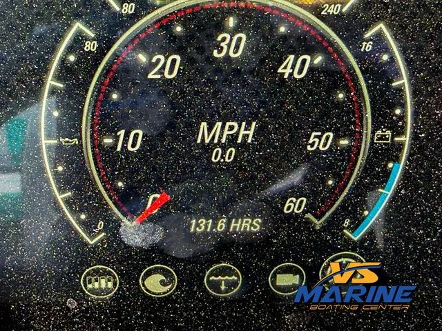 Slide: The Image of Dashboard of 2020 Malibu 25 LSV boat showing speedometer and 131.6 hours usage. - 10