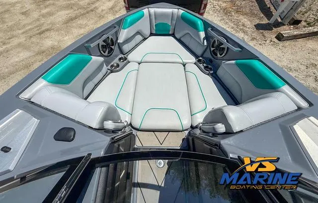 Slide: The Image of 2020 Malibu 25 LSV boat interior with teal and gray seating, VS Marine logo. - 8