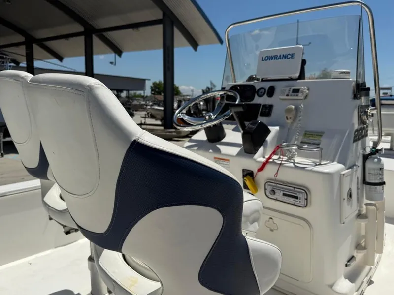 Slide: The Image of 2007 Century 2202 BAY boat interior with seating and console, viewed from the stern. - 10