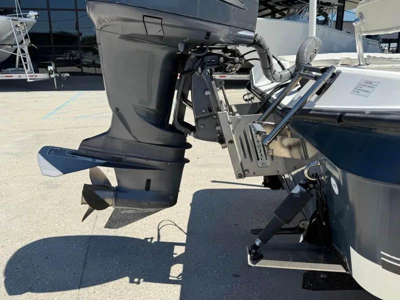 Slide: The Image of Outboard motor of 2007 Century 2202 BAY boat, displayed on a concrete surface. - 13