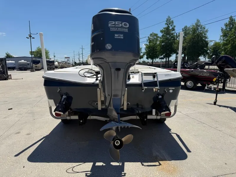 Slide: The Image of 2007 Century 2202 BAY boat cockpit with steering wheel and Lowrance navigation system. - 5