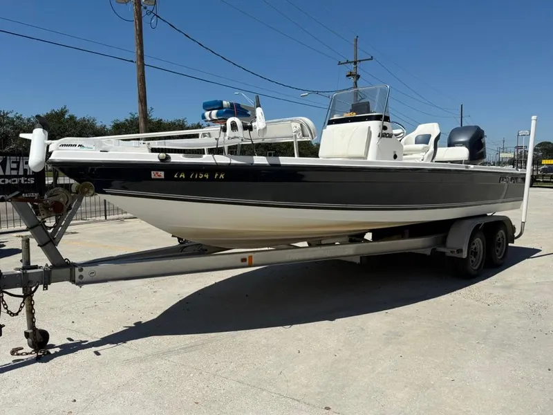 Slide: The Image of 2007 Century 2202 BAY boat interior with seating, docked under clear blue sky. - 7
