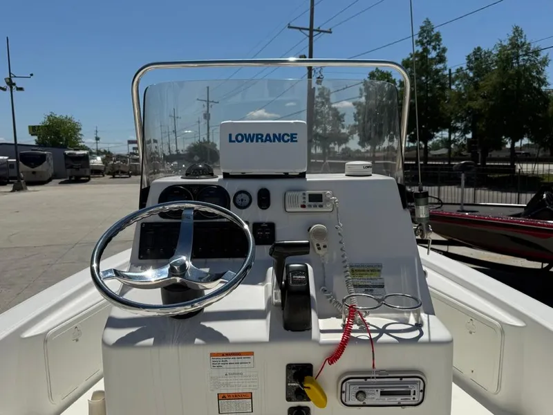 Slide: The Image of 2007 Century 2202 BAY boat console with steering wheel and Lowrance navigation system. - 9