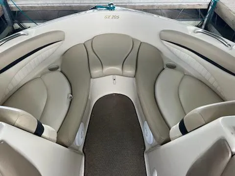 Slide: The Image of 2004 Glastron GS 205 boat interior with beige seating and cup holders. - 5