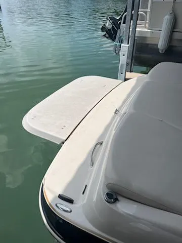 Slide: The Image of 2004 Glastron GS 205 boat with swim platform on calm water. - 6