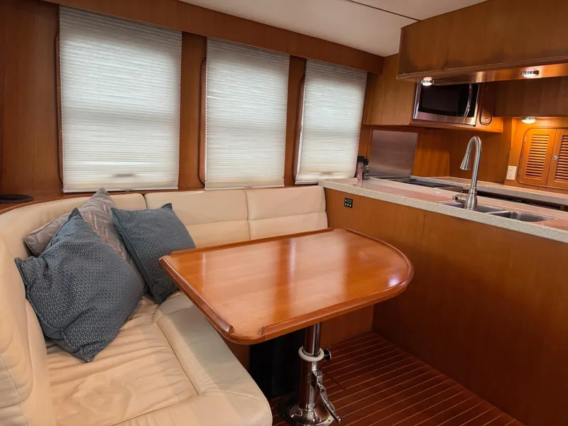 Slide: The Image of Interior of 2003 Nordhavn N46 yacht with cozy dining area and modern kitchen. - 13