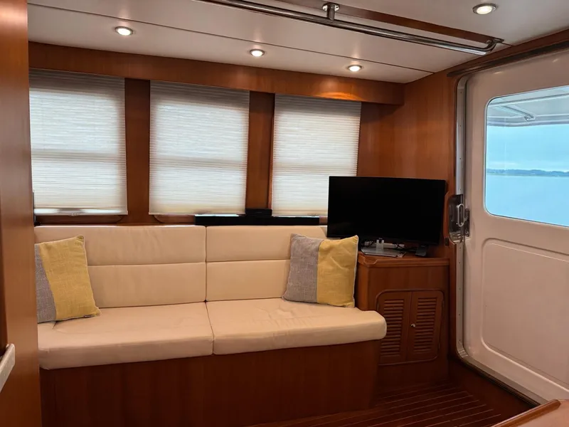 Slide: The Image of Luxurious interior of 2003 Nordhavn N46 yacht with cozy seating and modern decor. - 17
