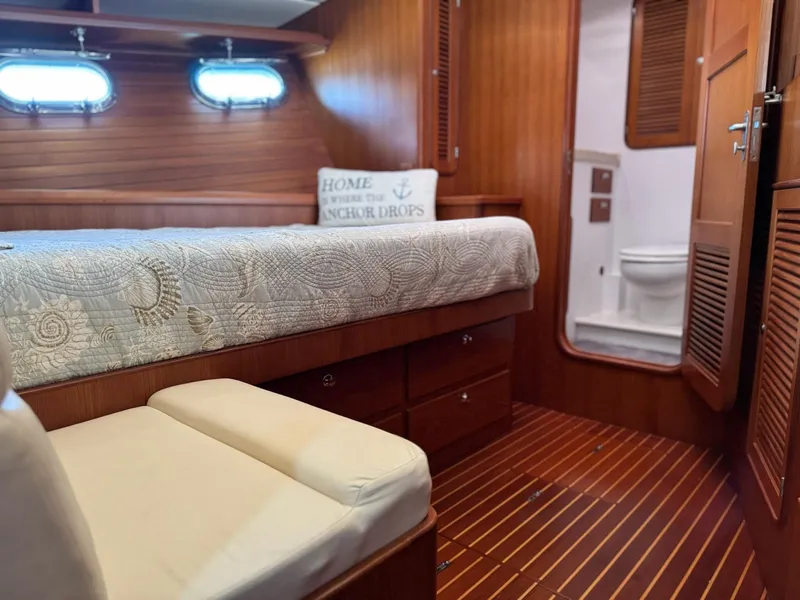 Slide: The Image of Cozy cabin interior of 2003 Nordhavn N46 yacht with wooden finish and comfortable bedding. - 27