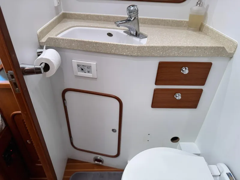 Slide: The Image of Bathroom interior of 2003 Nordhavn N46 yacht with sink, toilet, and storage. - 30