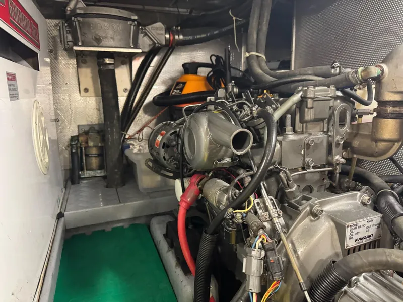 Slide: The Image of Engine room of a 2003 Nordhavn N46 yacht, showcasing mechanical components and wiring. - 34