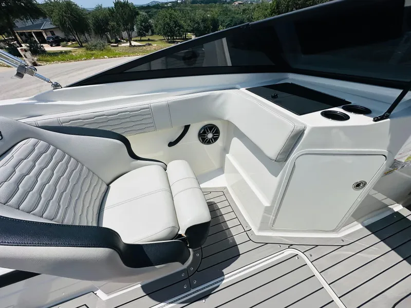 Slide: The Image of 2022 Sea Ray SPX 210 boat interior with sleek seating and modern dashboard design. - 26
