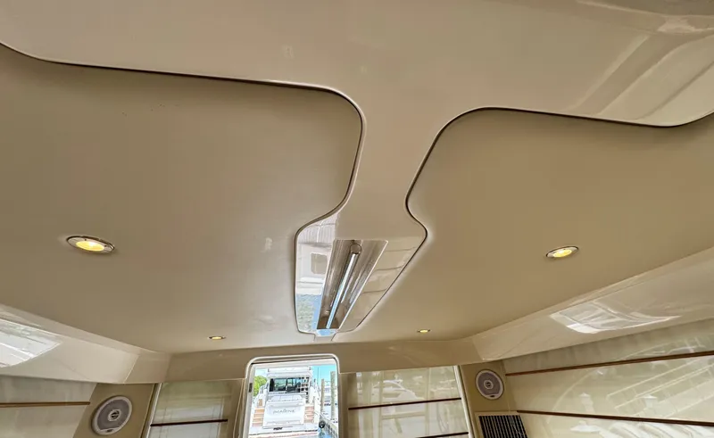 Slide: The Image of Interior ceiling of 2005 Riviera 33 Flybridge with modern lighting and sleek design. - 22