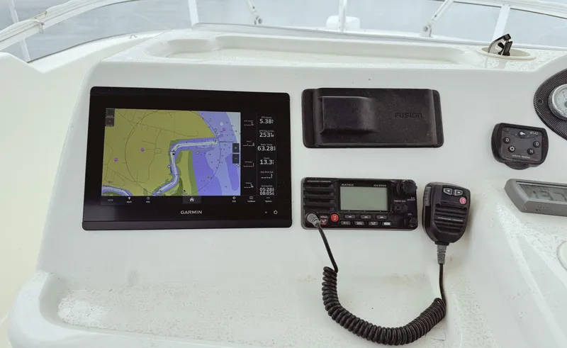 Slide: The Image of Control panel of 2005 Riviera 33 Flybridge with navigation and communication equipment. - 42