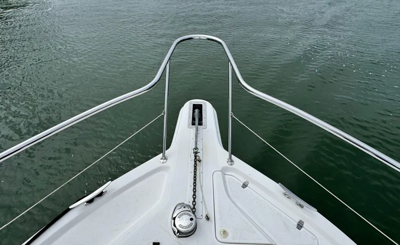 Slide: The Image of Bow view of 2005 Riviera 33 Flybridge on calm water. - 47