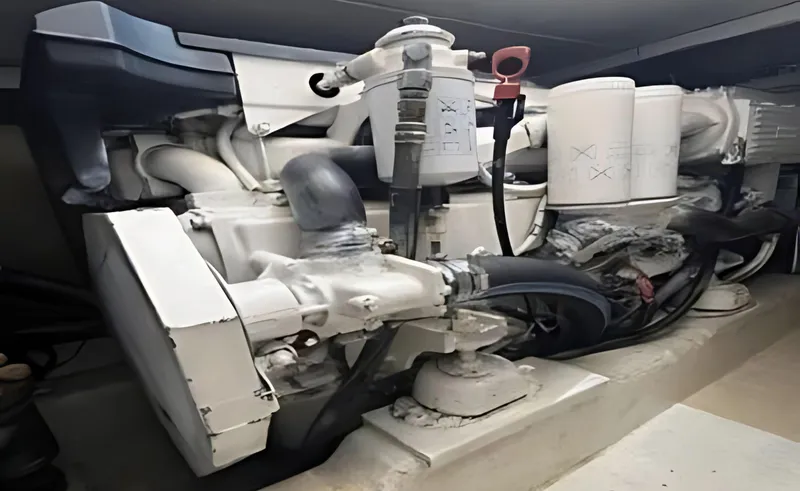 Slide: The Image of Engine compartment of a 2005 Riviera 33 Flybridge boat, showcasing mechanical components. - 48