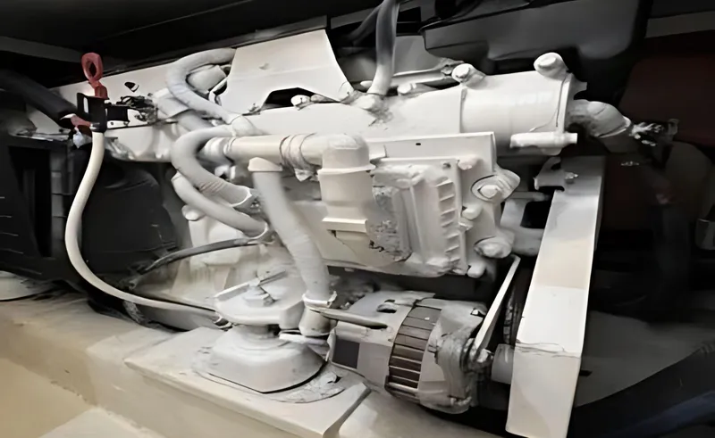 Slide: The Image of Engine compartment of a 2005 Riviera 33 Flybridge boat, showcasing mechanical components. - 49