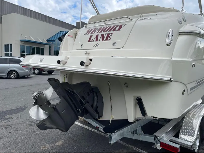 Slide: The Image of Rear view of a 2006 Monterey 250 CR boat named "Memory Lane" on a trailer. - 14