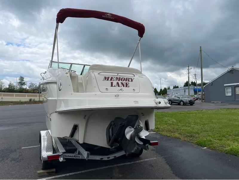 Slide: The Image of 2006 Monterey 250 CR boat named "Memory Lane" on trailer in parking lot. - 17