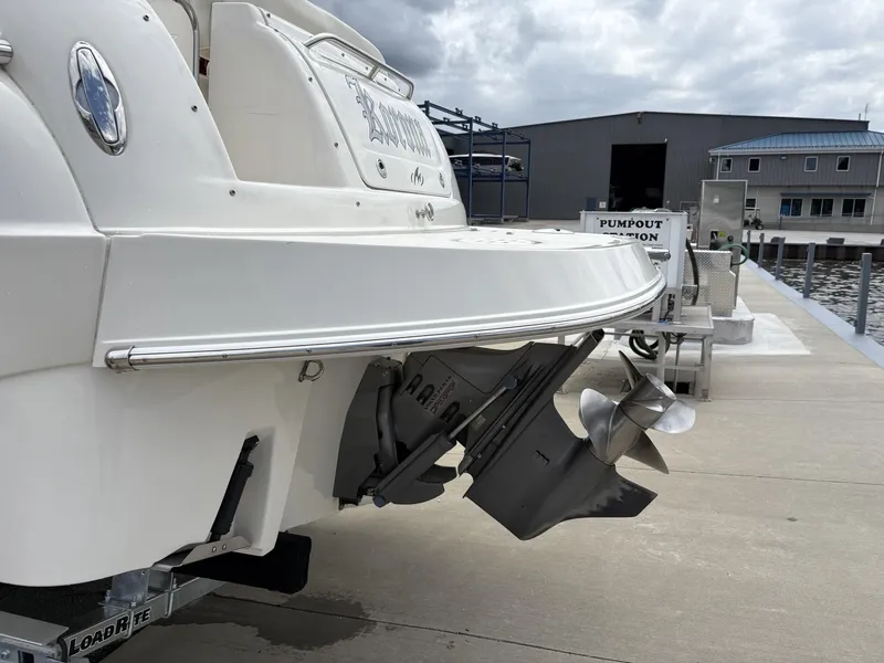Slide: The Image of 2006 Monterey 250 CR boat at dockside with visible propeller and pumpout station. - 28