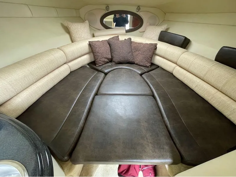 Slide: The Image of Luxurious interior of a 2006 Monterey 250 CR boat with plush seating and cushions. - 38