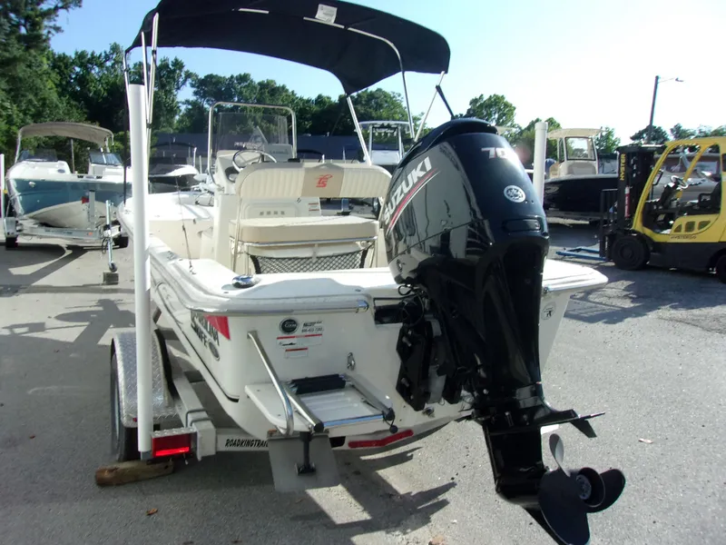 Slide: The Image of 2019 Carolina Skiff 18 JVX CC boat with Suzuki outboard motor on trailer. - 11