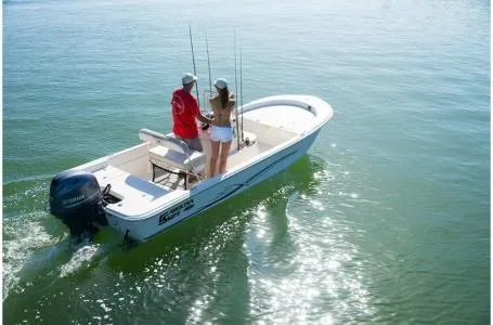 Slide: The Image of 2019 Carolina Skiff 18 JVX CC boat on water with two people fishing. - 14