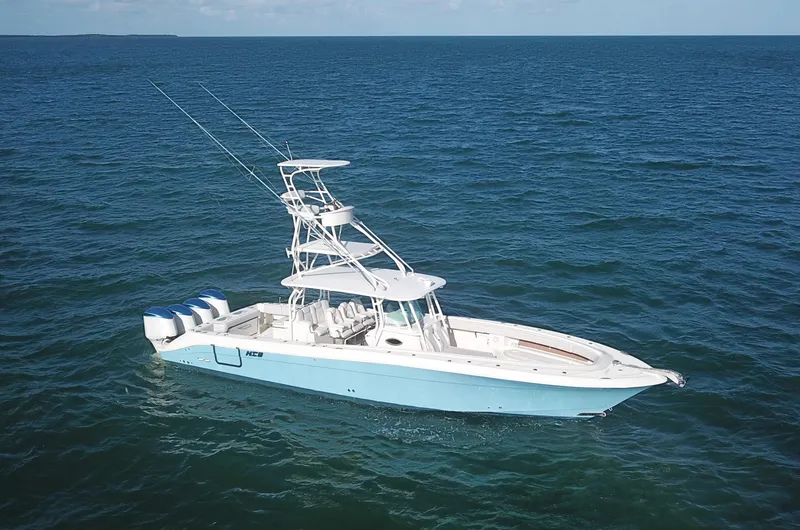 Slide: The Image of 2014 Hydra-Sports 42 boat on open ocean, featuring multiple outboard engines. - 10