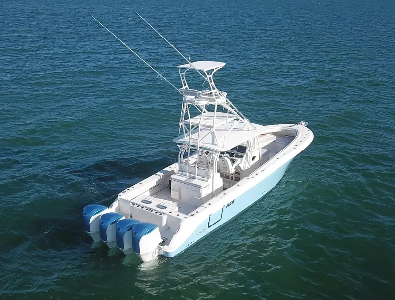 Slide: The Image of 2014 Hydra-Sports 42 boat with triple engines on open water. - 13