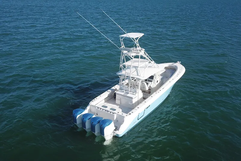 Slide: The Image of 2014 Hydra-Sports 42 boat with four engines on open water. - 18