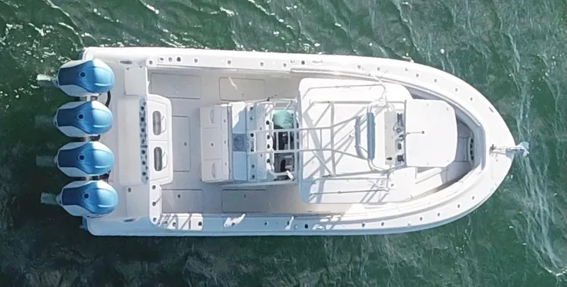 Slide: The Image of Aerial view of 2014 Hydra-Sports 42 boat with four outboard motors on water. - 35