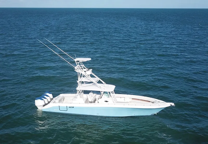 Slide: The Image of 2014 Hydra-Sports 42 boat on open ocean, featuring multiple outboard engines. - 4