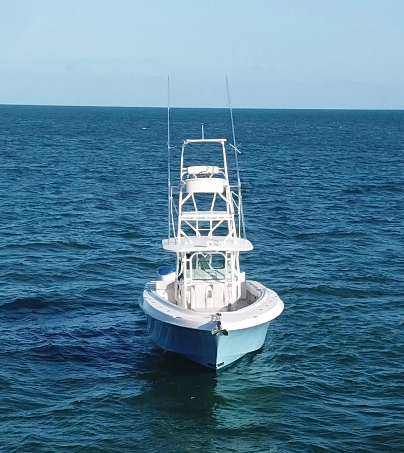 Slide: The Image of 2014 Hydra-Sports 42 boat on open sea, clear blue water. - 43