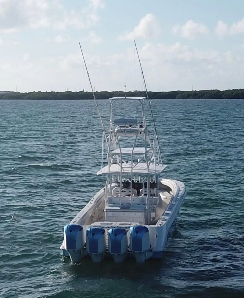 Slide: The Image of 2014 Hydra-Sports 42 boat with four engines on open water. - 45