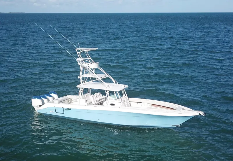 Slide: The Image of 2014 Hydra-Sports 42 boat on open ocean, featuring multiple outboard engines. - 5