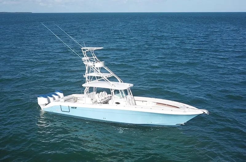 Slide: The Image of 2014 Hydra-Sports 42 boat on open ocean, featuring multiple outboard engines. - 8