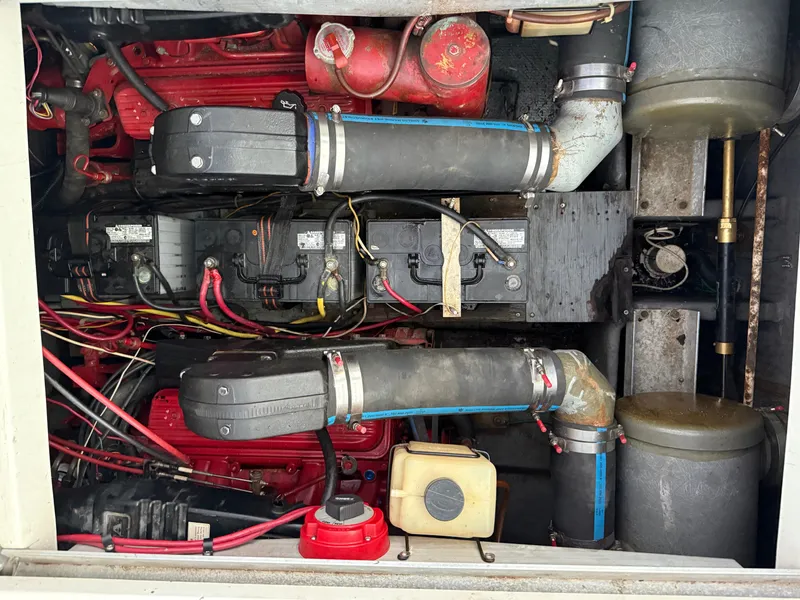 Slide: The Image of Engine compartment of a 1992 Carver Command Bridge 2828 with visible components and wiring. - 27