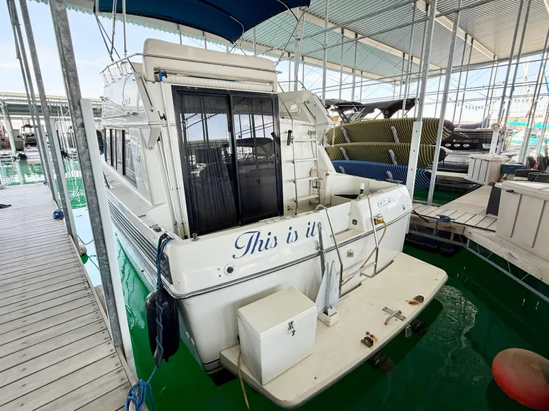 Slide: The Image of 1992 Carver Command Bridge 2828 docked in marina, rear view. - 29
