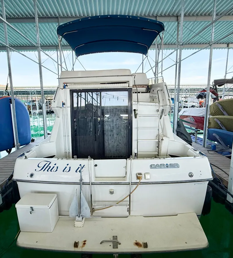 Slide: The Image of 1992 Carver Command Bridge 2828 docked under a covered marina. - 4