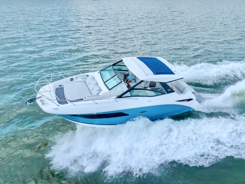 Slide: The Image of 2020 Sea Ray Sundancer 320 cruising on open water, showcasing sleek design and performance. - 0