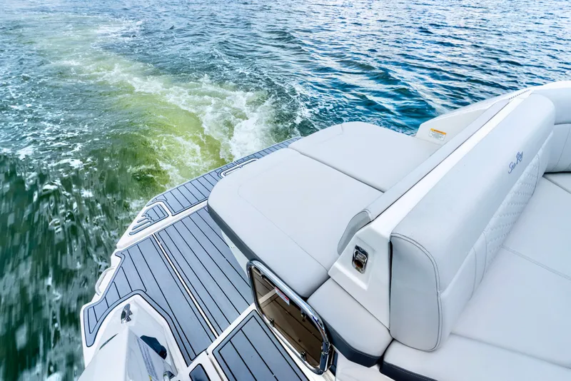 Slide: The Image of 2020 Sea Ray Sundancer 320 boat with sleek deck design on open water. - 10