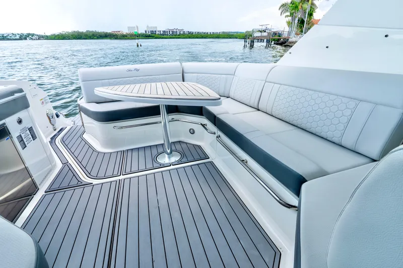 Slide: The Image of Luxurious seating area on 2020 Sea Ray Sundancer 320 yacht with waterfront view. - 12